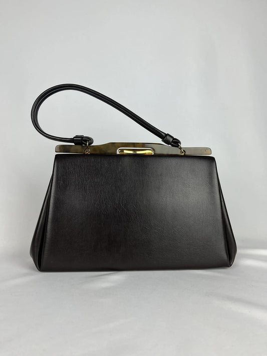 Vintage leather handbag with golden metal